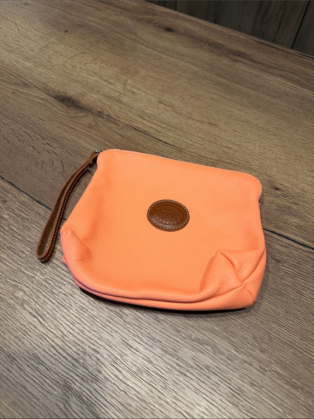 Roots Coral Leather Wristlet Pouch with Brown Trim